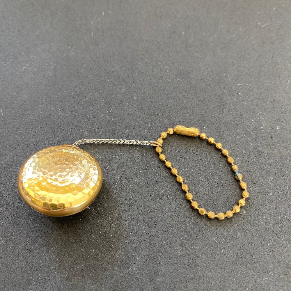 Vintage Collectible Pin with retractable chain.